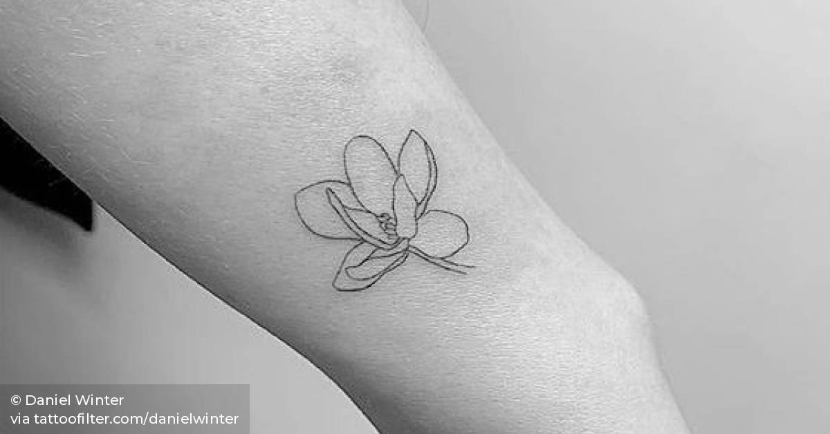 Magnolia tattoo on the wrist.