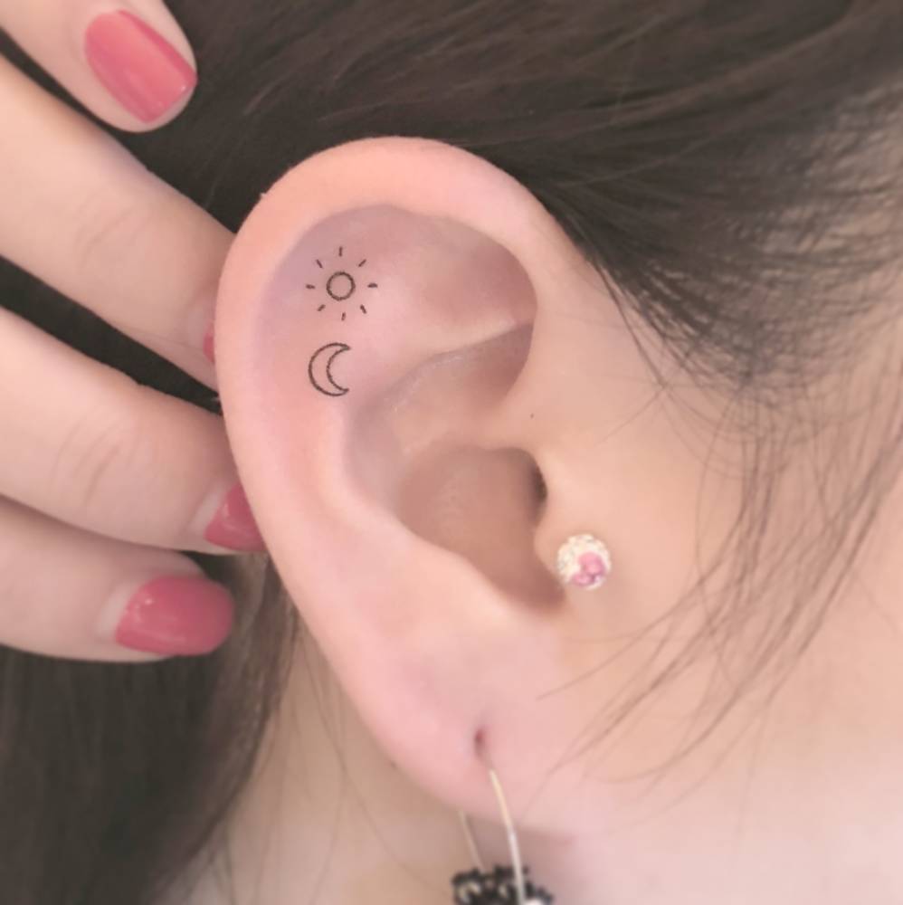Sun And Moon Tattoo On The Right Ear  Sun And Moon Tattoo On The Right Ear
