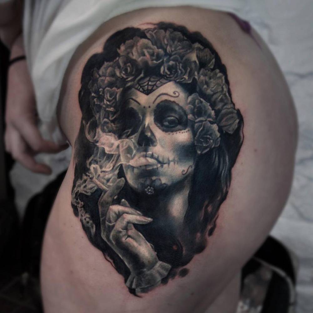 Realistic La Calavera Catrina tattoo on the left side of the ass.