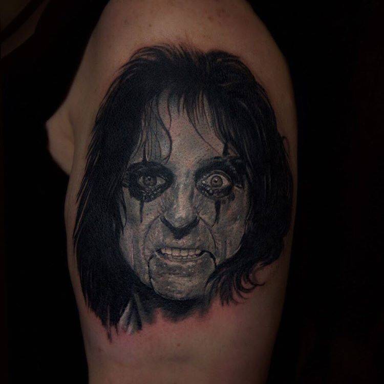 Realistic Alice Cooper portrait tattoo on the left