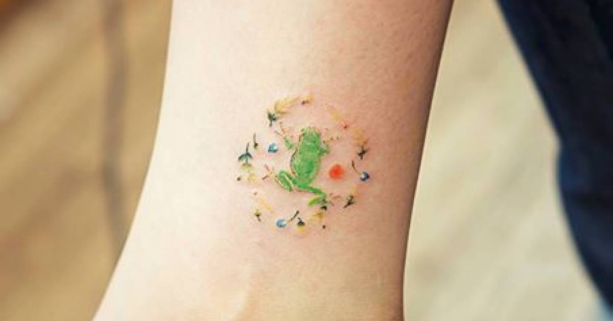 Small frog tattoo on the right inner ankle.