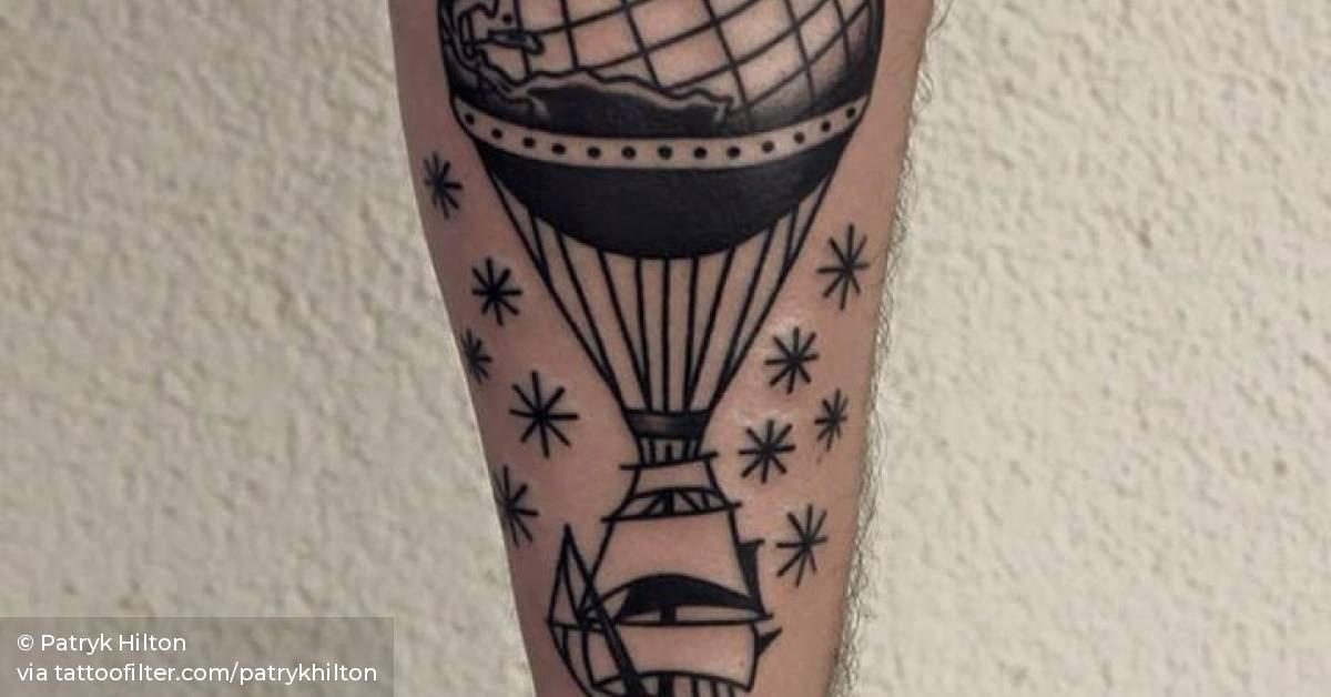 Sailing ship air ballon tattoo on the forearm.