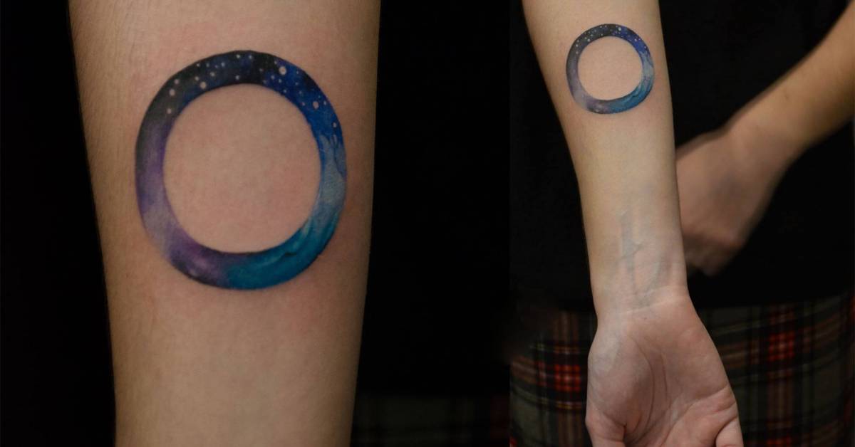 Galactic circle tattoo on the right inner forearm.