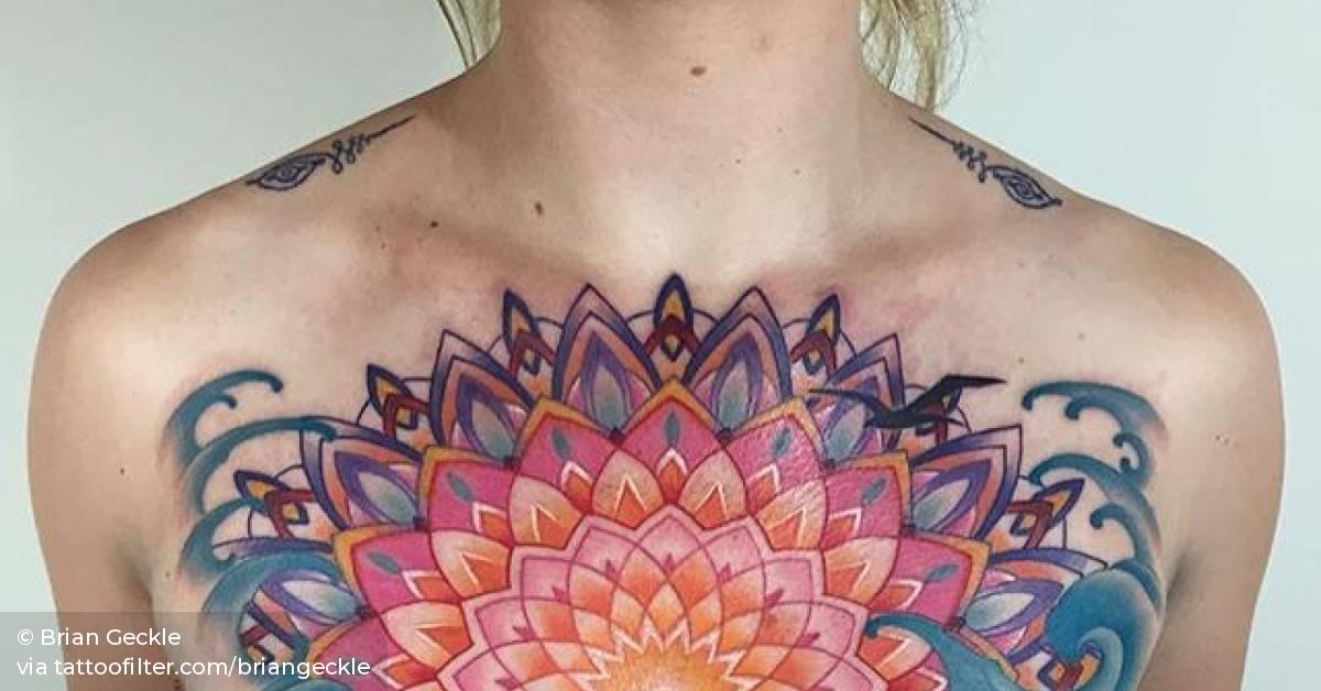 Half mandala tattoo on the chest.
