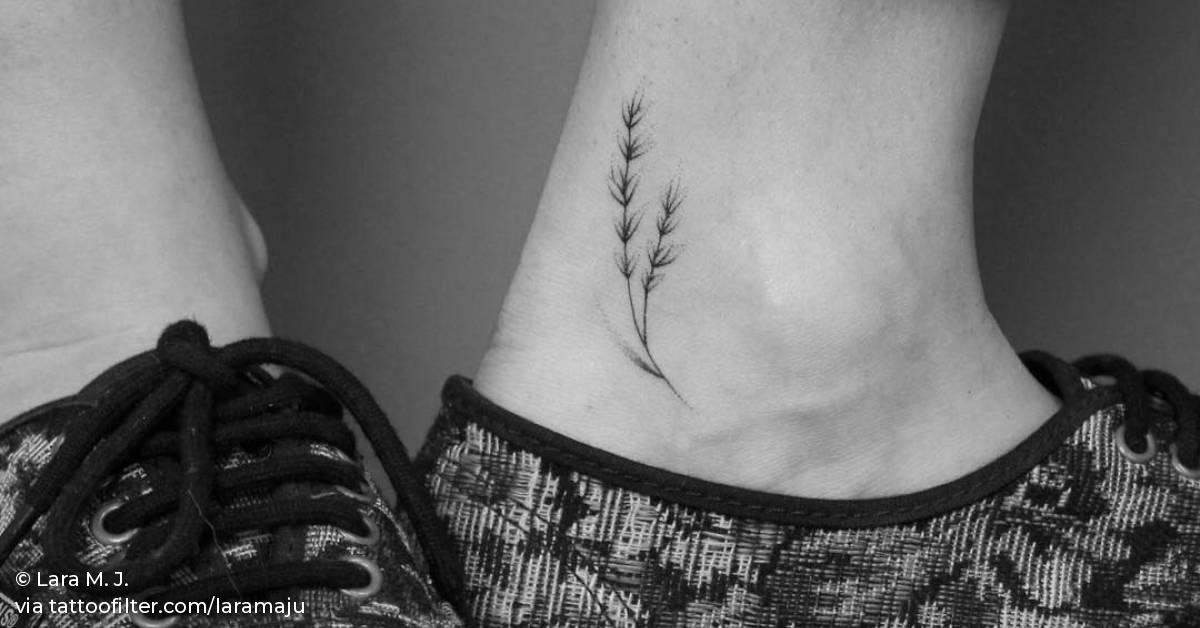 Hand poked flower tattoo on the left inner ankle.