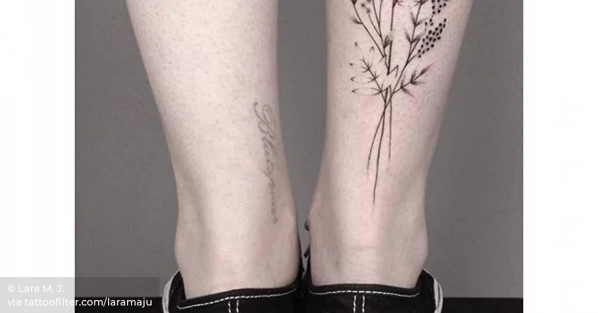 Hand poked wild flower tattoos on the right Achilles