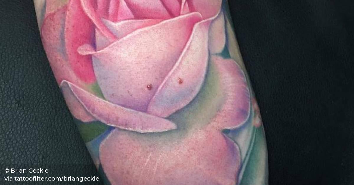 Pretty pink rose tattoo on Mallory.