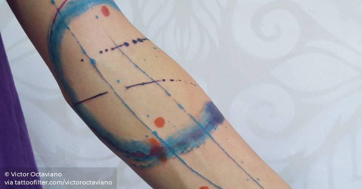 Abstract tattoo on the left arm.