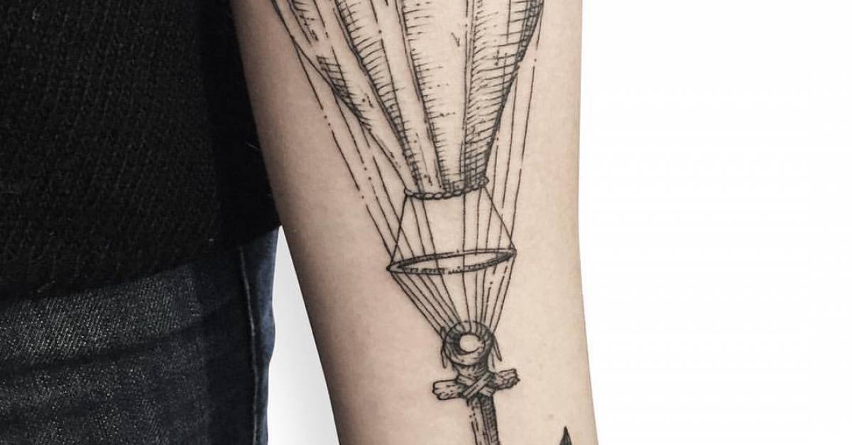 Engraving style anchor air ballon tattoo on the inner
