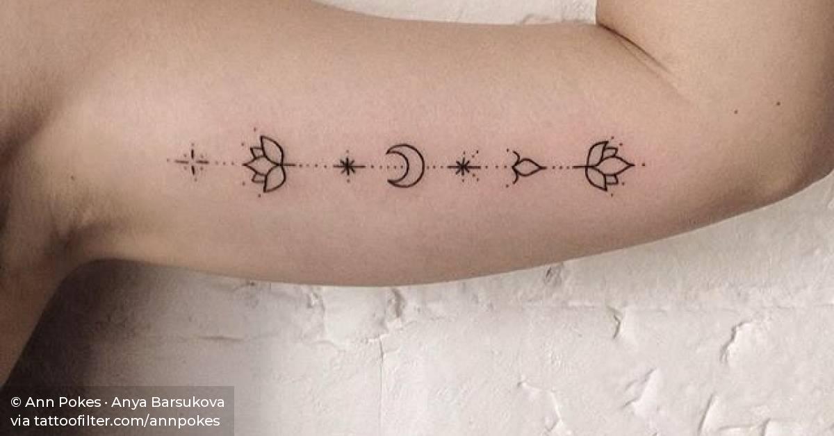 Hand poked ornaments on the left inner arm.