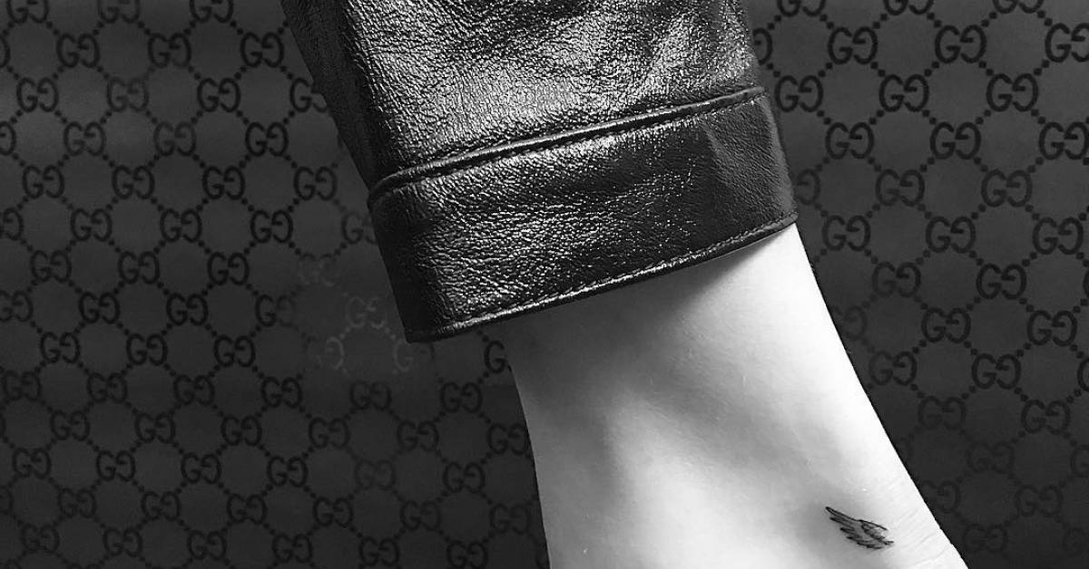 Minimalist wing tattoo on Bella Hadid's right Achilles