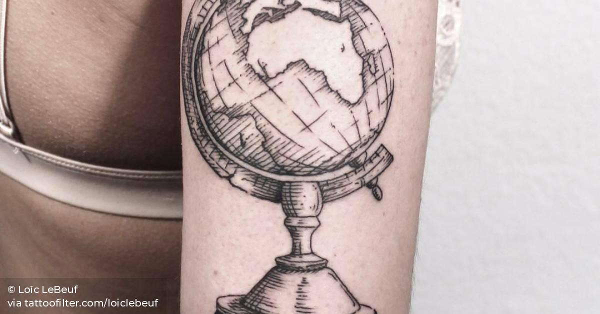 World globe tattoo on the back of the right arm.