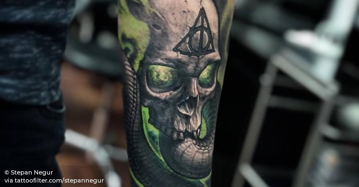 Realistic dark mark skull tattoo.