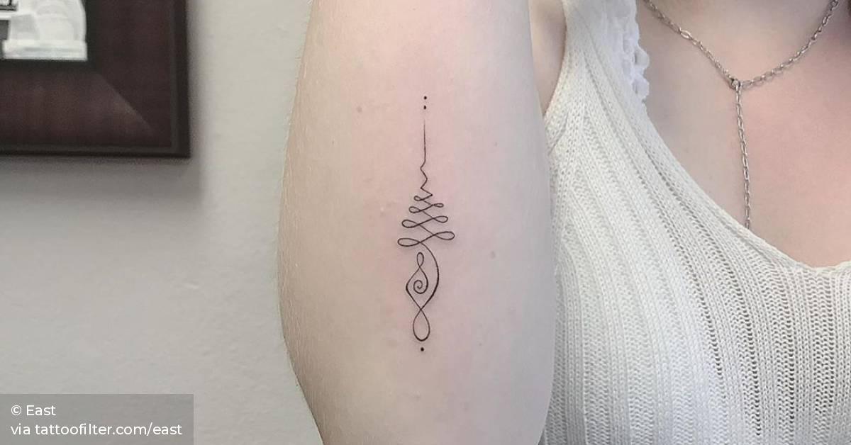 Unalome tattoo on the forearm.