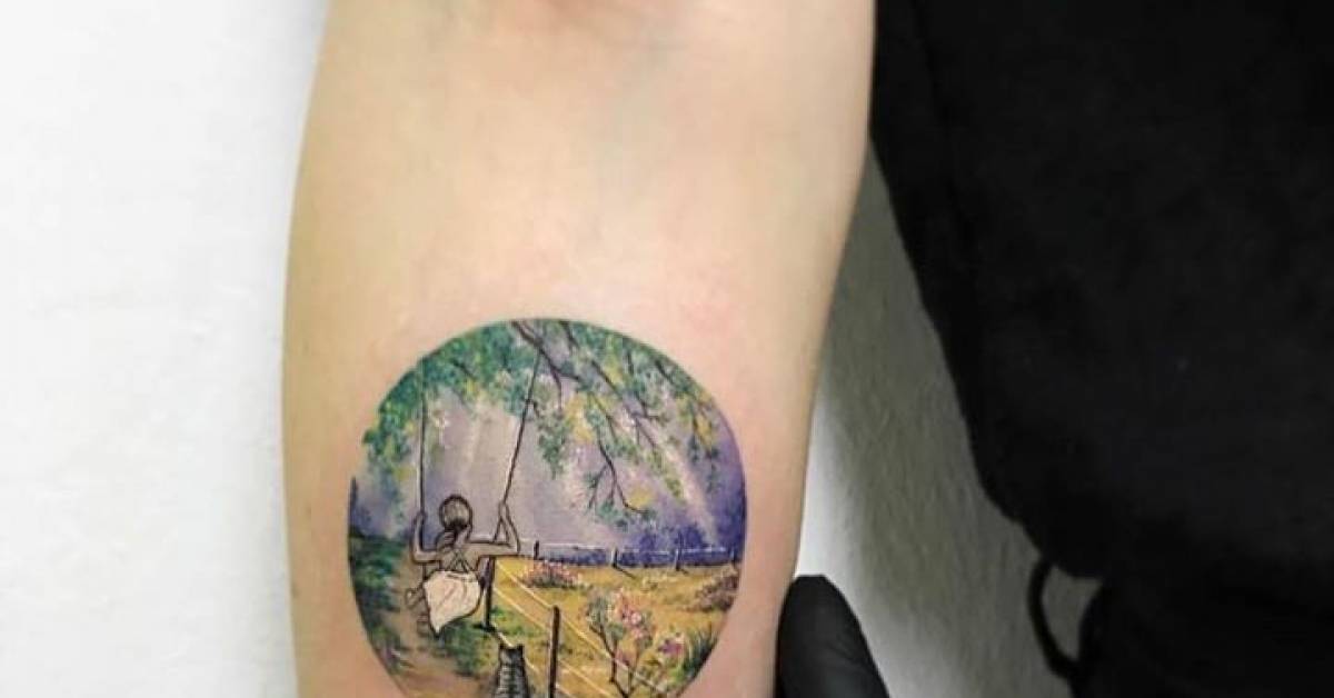 Illustrative child on a swing circle tattoo on the