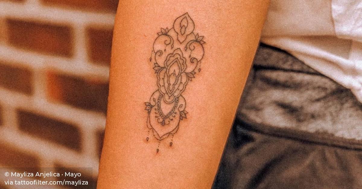 Ornamental vagina tattoo.