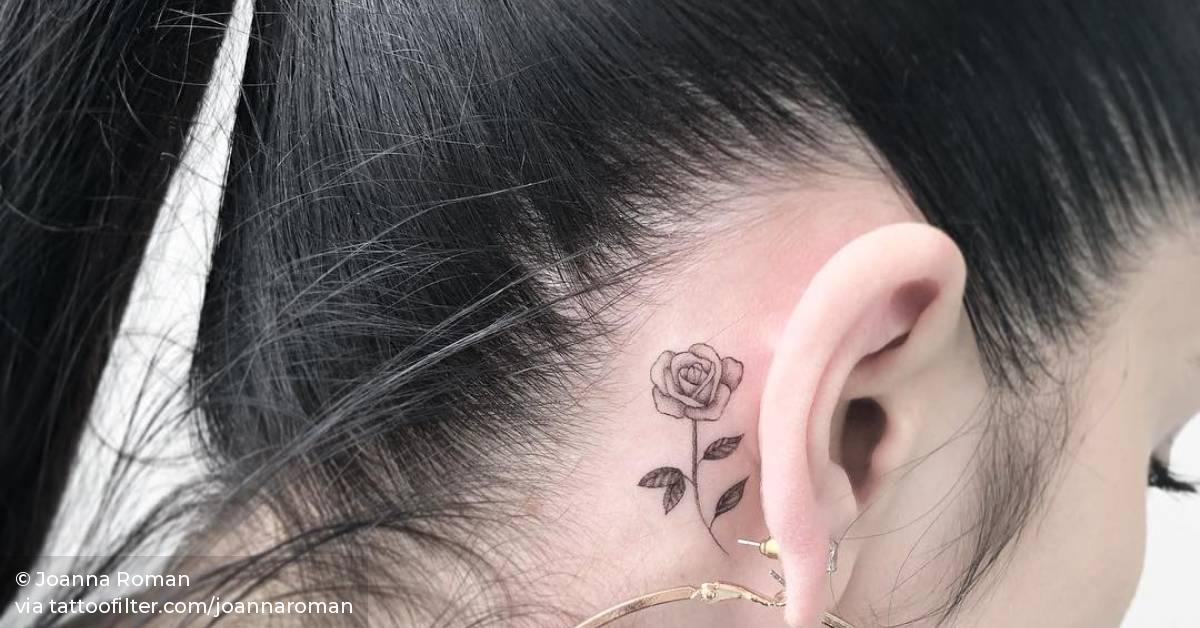 Rose tattoo behind the ear.