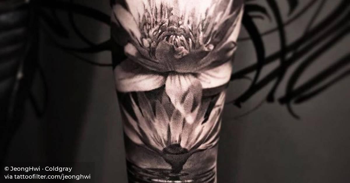 Black and grey lotus flower tattoo on the inner