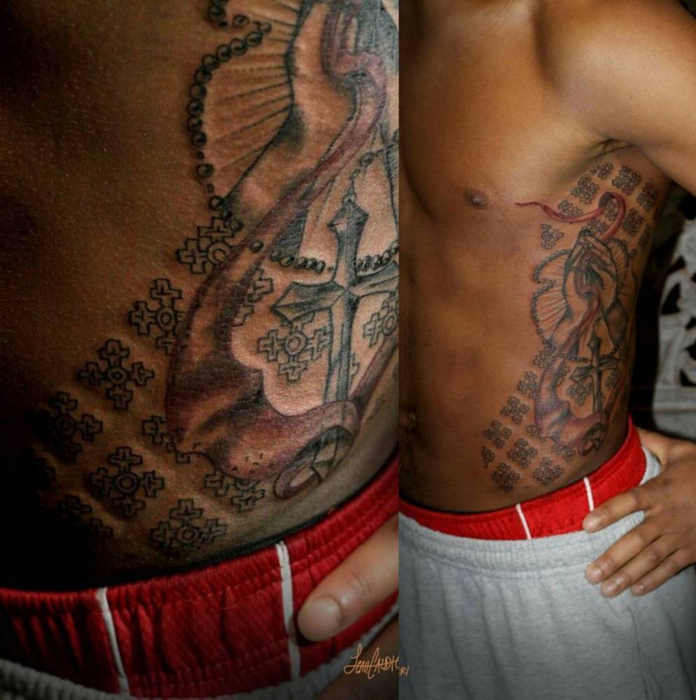 praying hands and geometric pattern of equal armed cross.