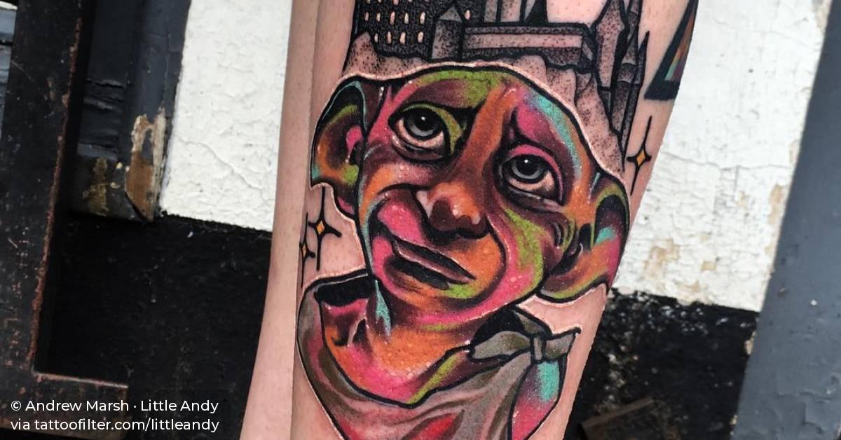 Dobby the elf tattoo on the leg.