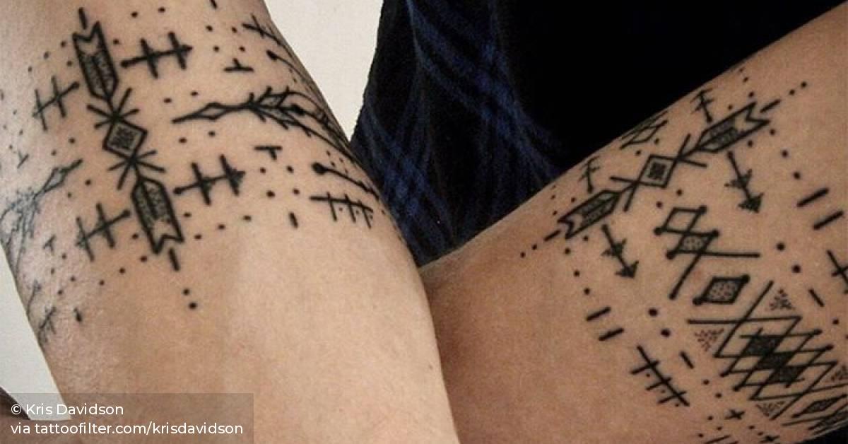 Matching ornamental armbands.