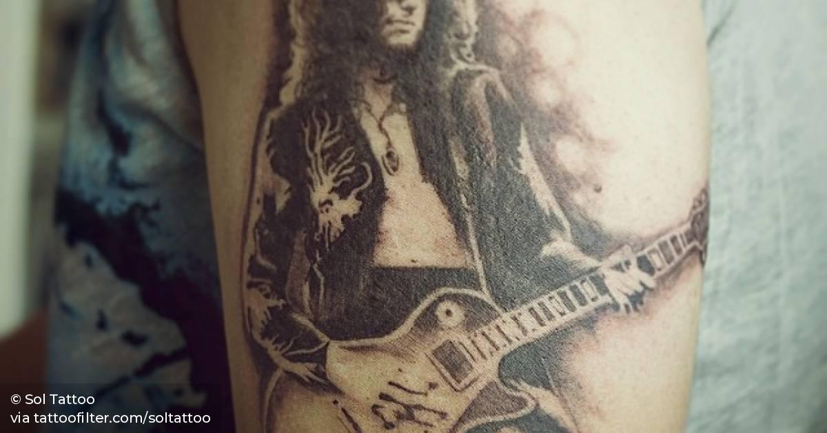 Jimmy Page tattoo on the upper arm.