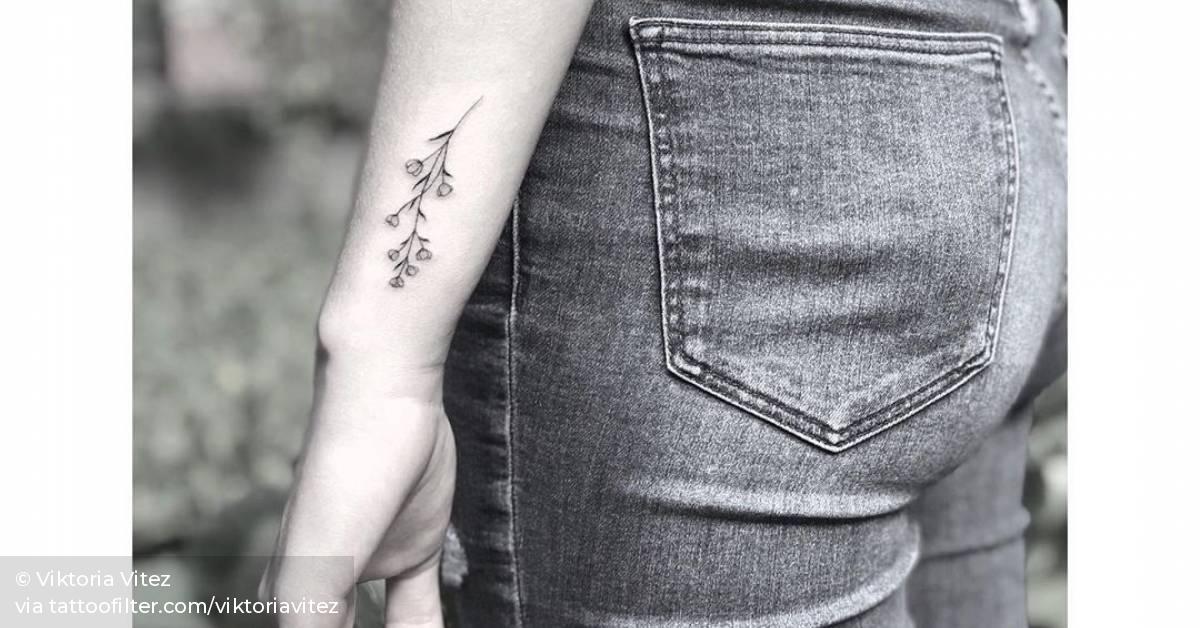 Little baby's breath flower tattoo on the wrist.