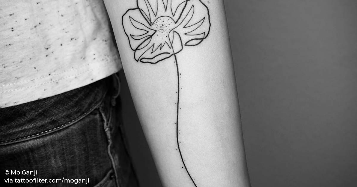 Poppy tattoo on the inner forearm.