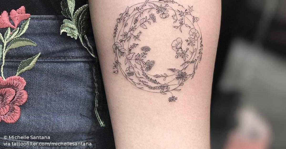 Single needle flower wreath tattoo on the left inner