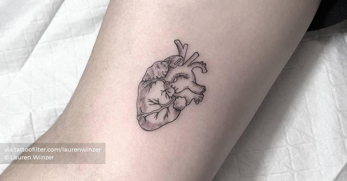 Anatomical heart tattoo on the inner arm.