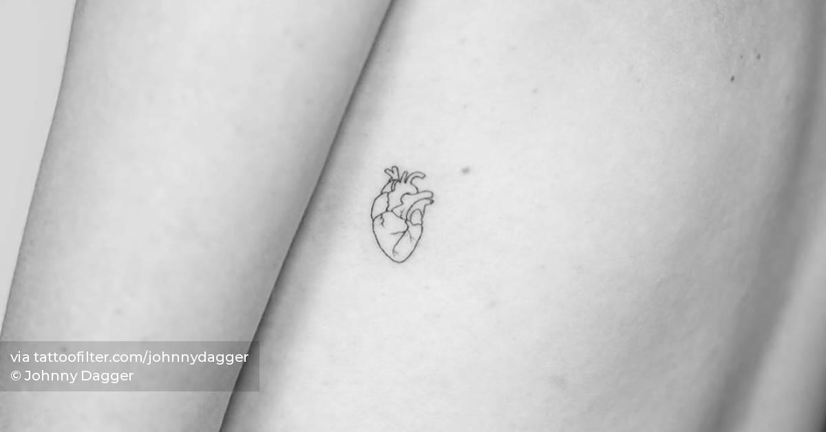 Fine line anatomical heart tattoo on the left side