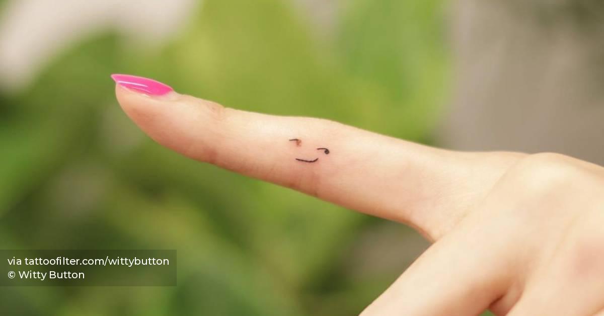 Smiley face birthmark coverup tattoo