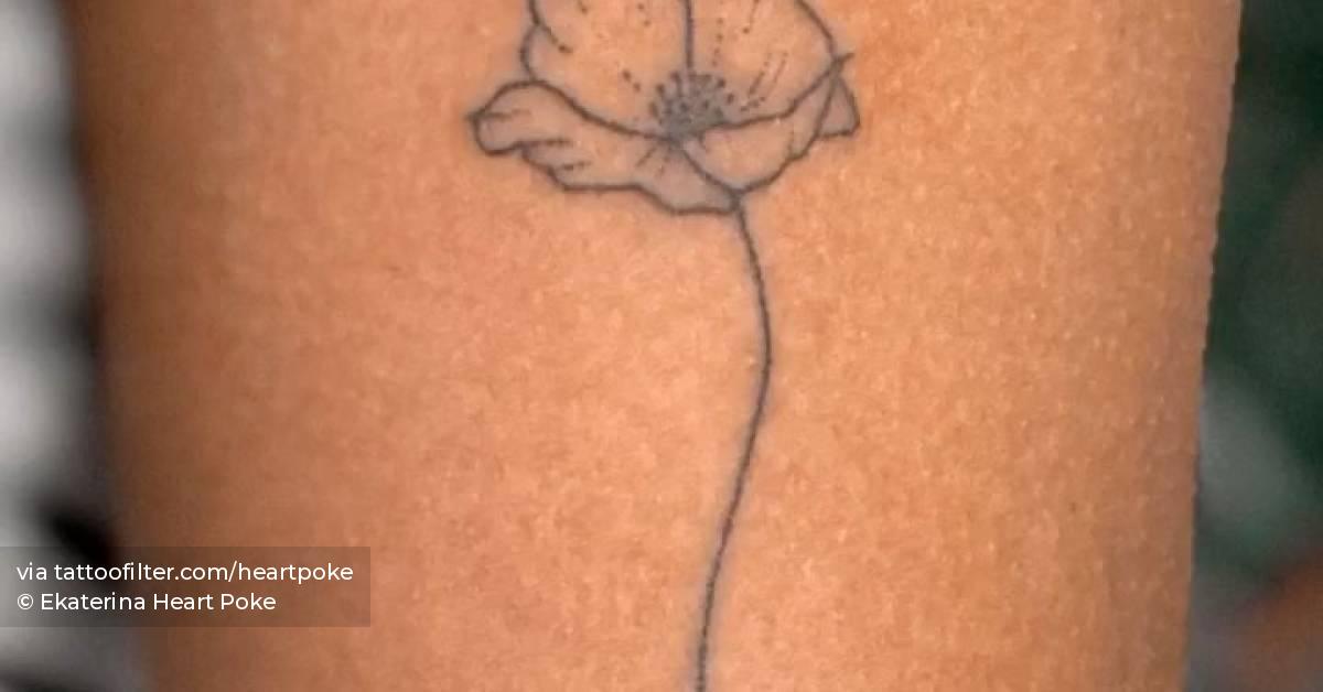 Hand poked poppy flower tattoo