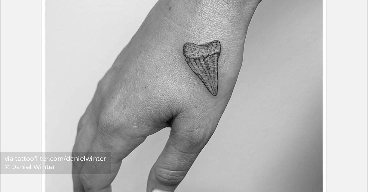 Shark Tooth tattoo on hand