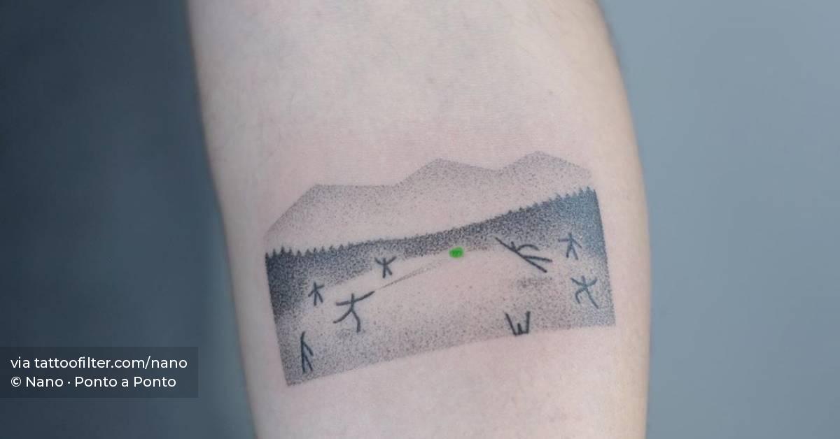 Hand poked tattoo on inner forearm