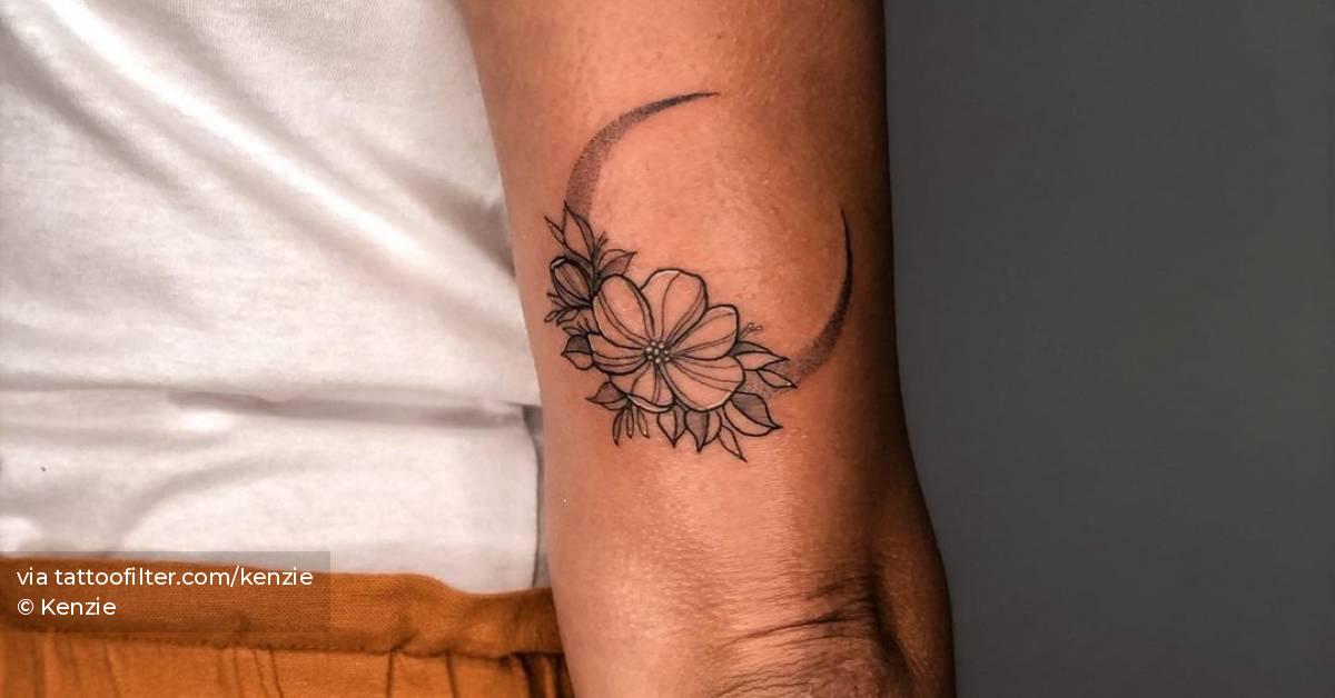 Fine line flower moon tattoo on the tricep