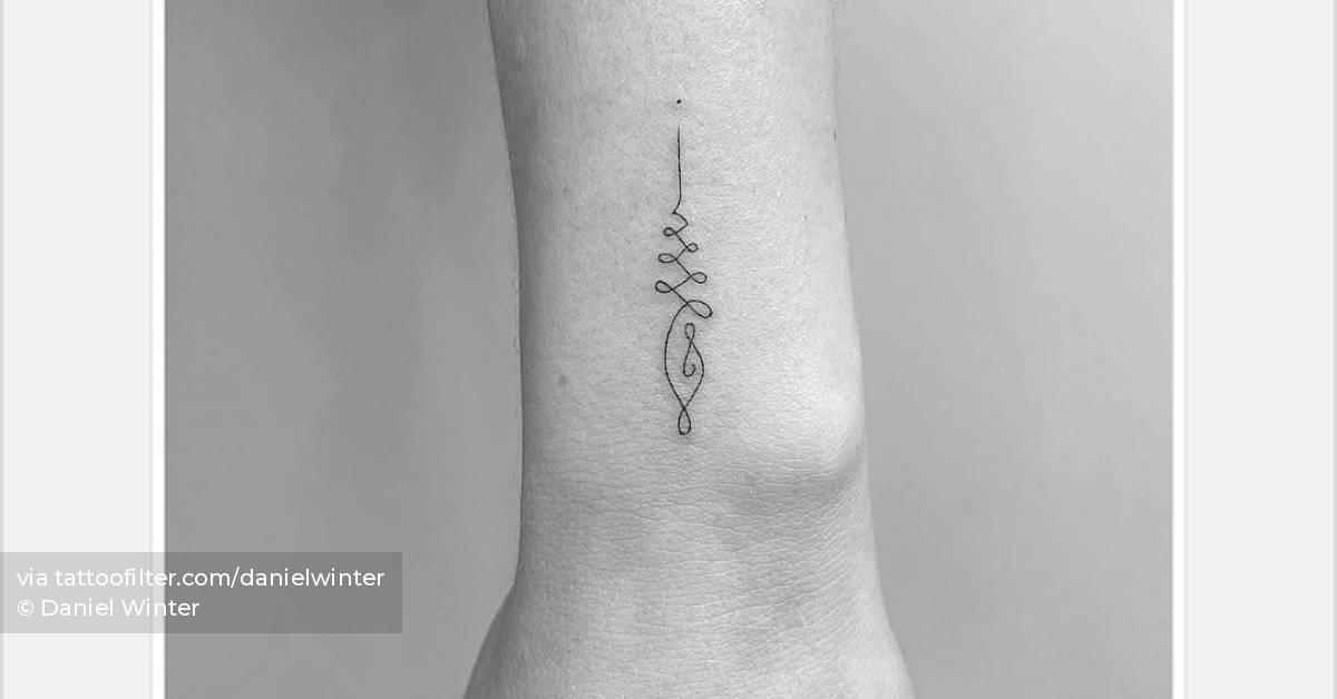 Fine line unalome tattoo on the wrist