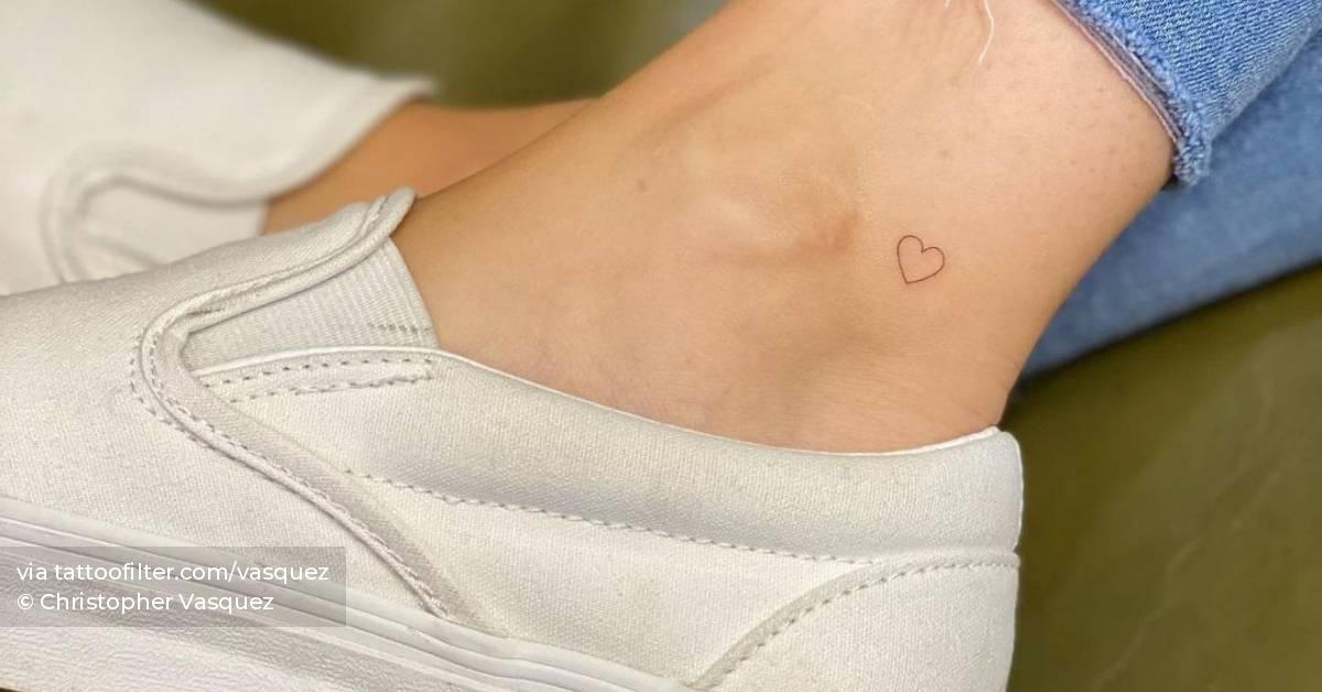 Minimalist heart tattoo on the ankle