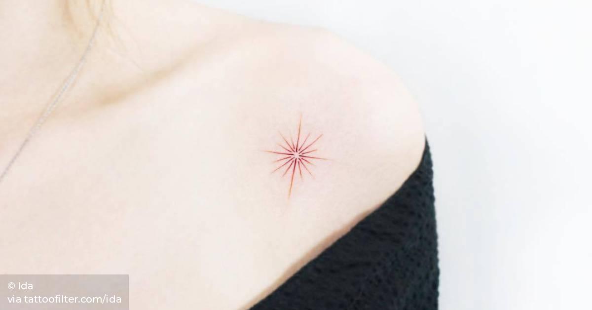 Red star tattoo on the left shoulder.