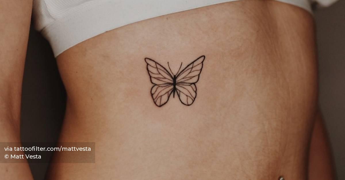 Line art butterfly tattoo on the rib.