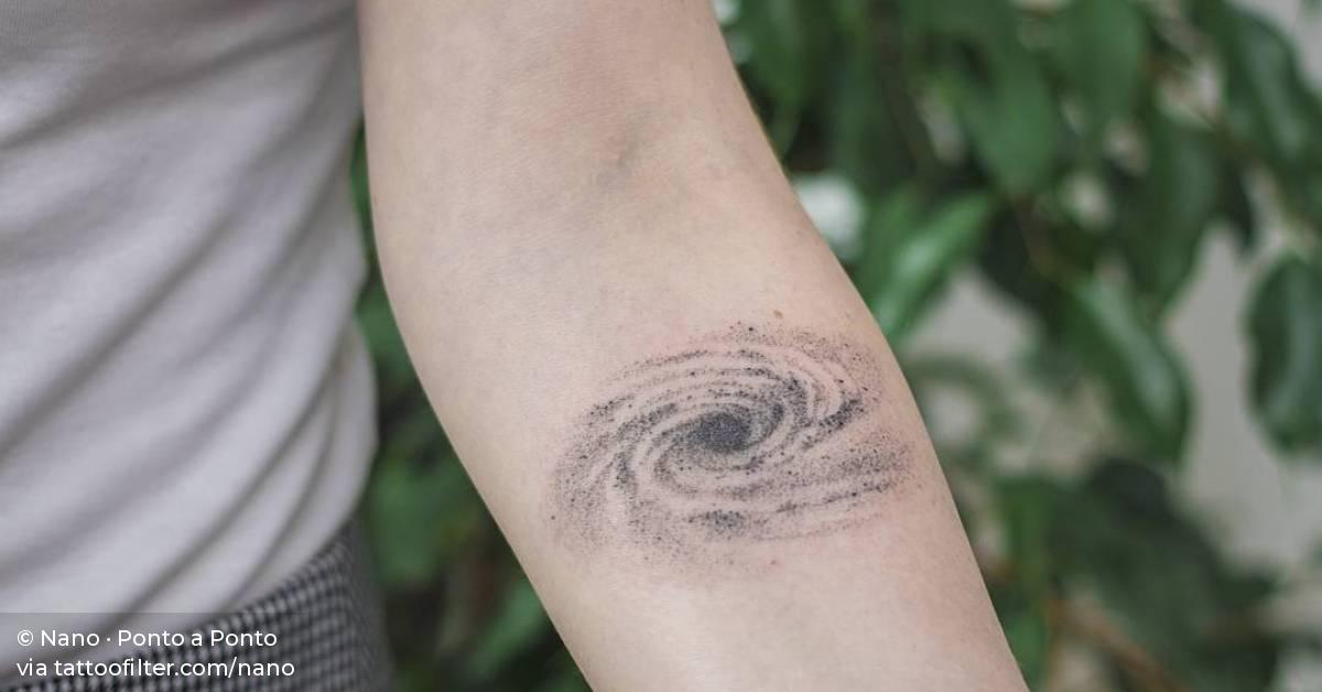 Hand poked galaxy tattoo on the left inner forearm.