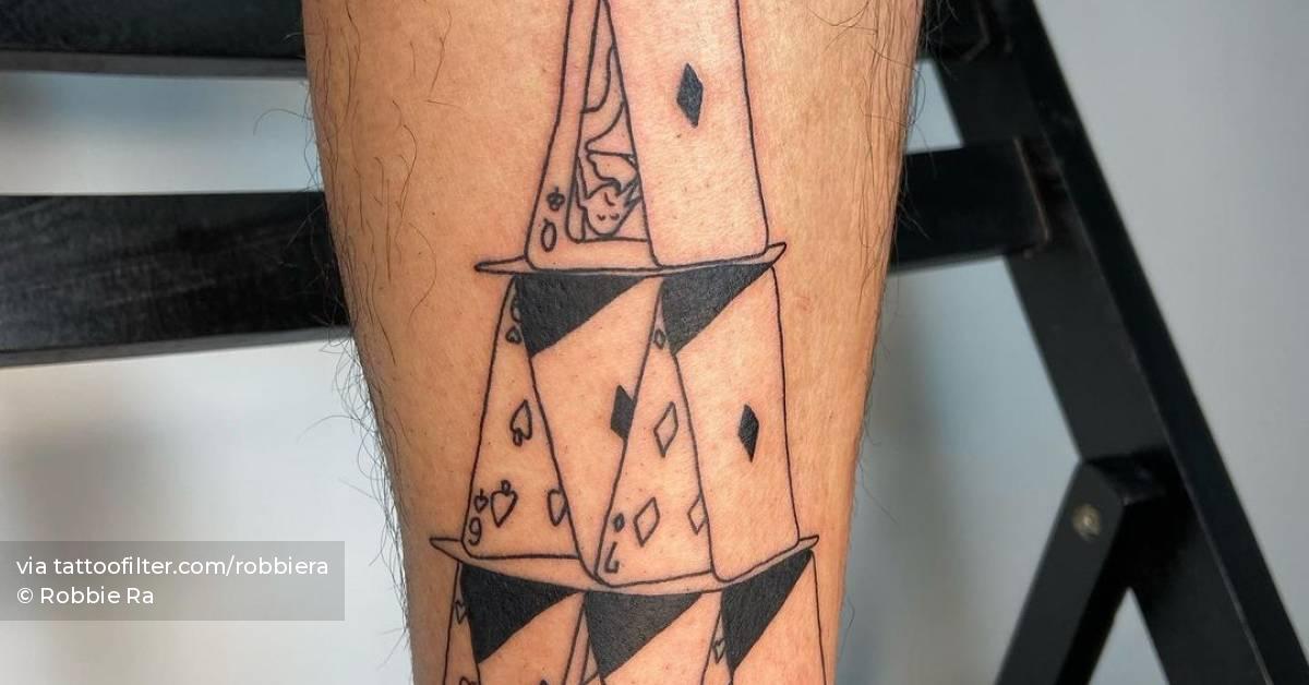 Hand poked house of cards tattoo on the shin.