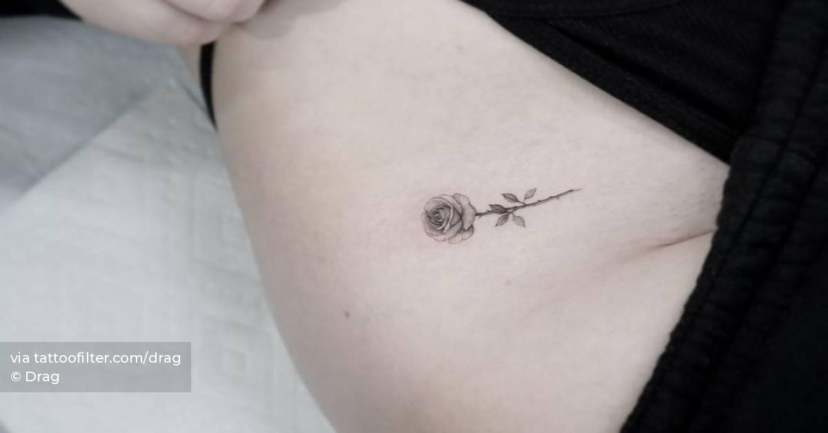 Single needle rose tattoo on the pelvis.