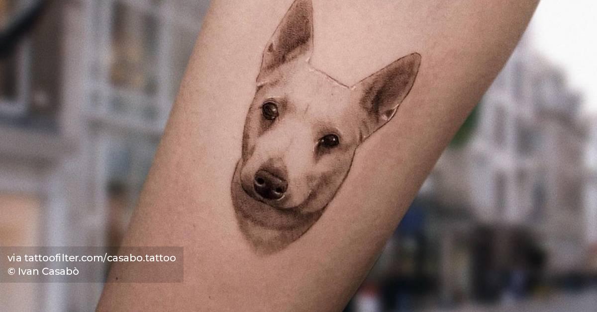 Micro-realistic dog portrait tattoo on the inner