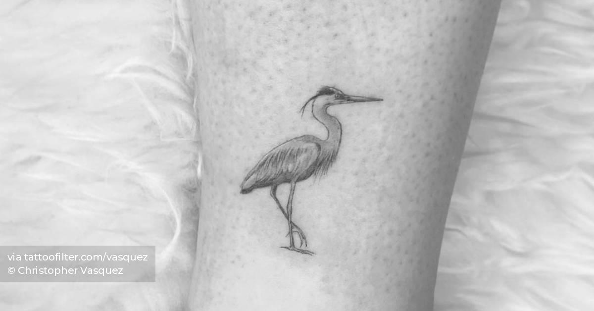 Microrealistic heron tattoo on the ankle.