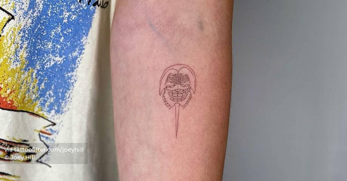 Single needle horseshoe crab tattoo on the inner