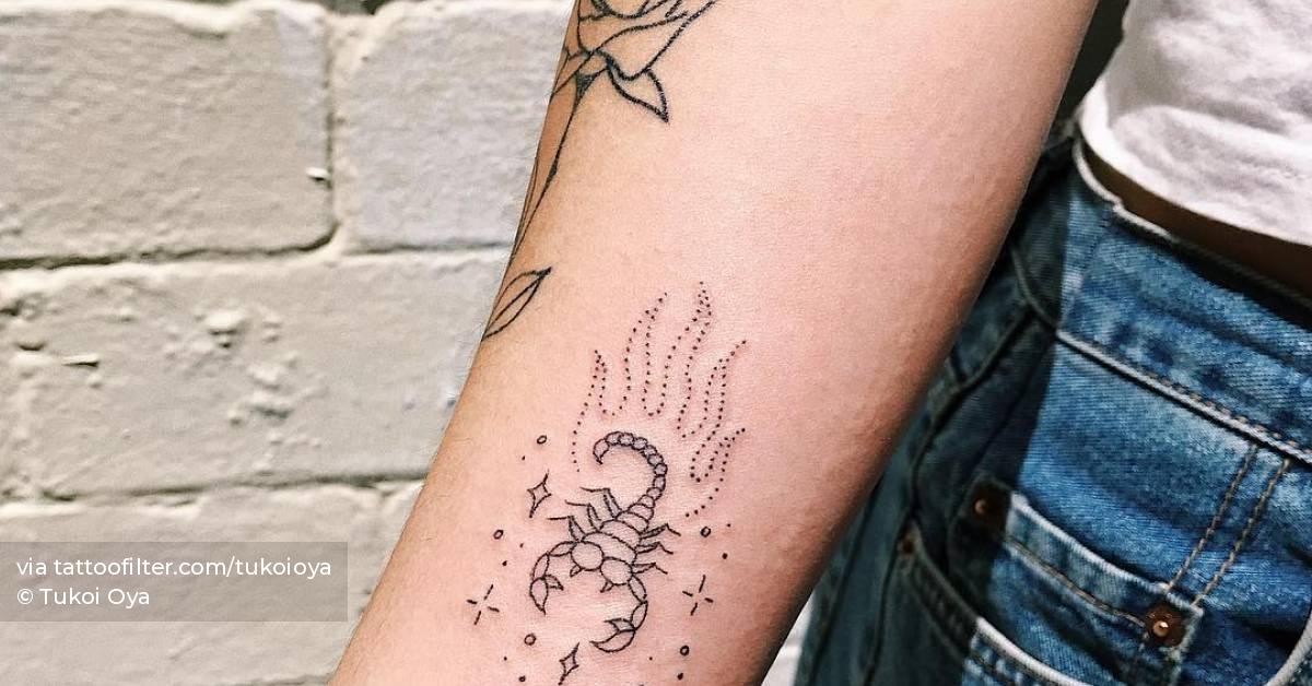 Scorpion tattoo on the inner forearm.