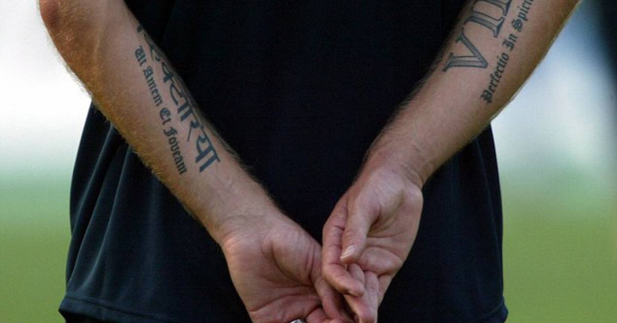 Roman lettering tattoo saying "Ut Amem Et Foveam",