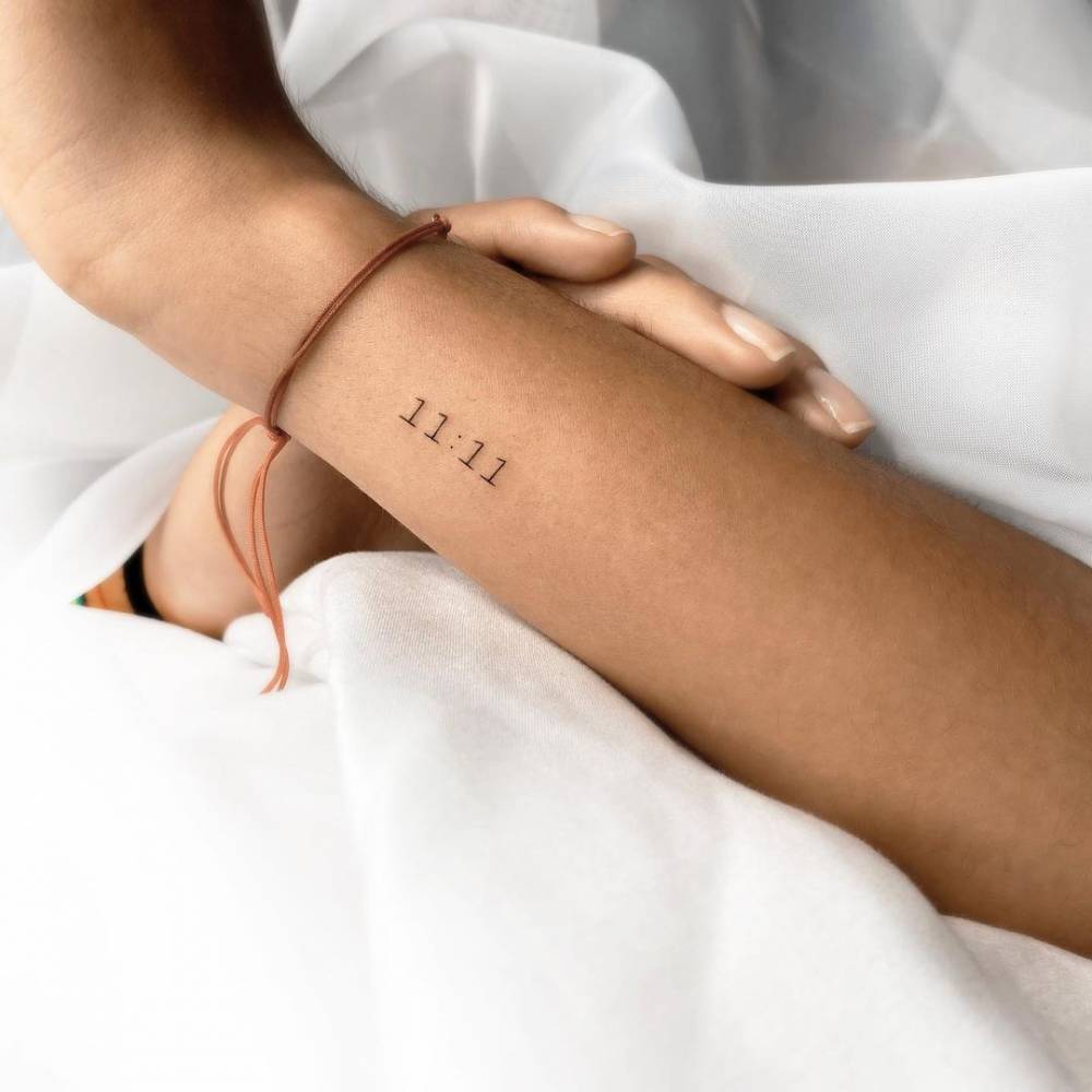  11 11 Lettering Tattoo On The Wrist 