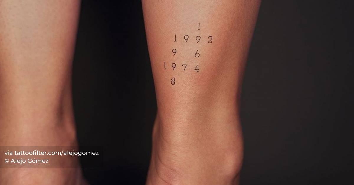Family birth years tattoo on the achilles.